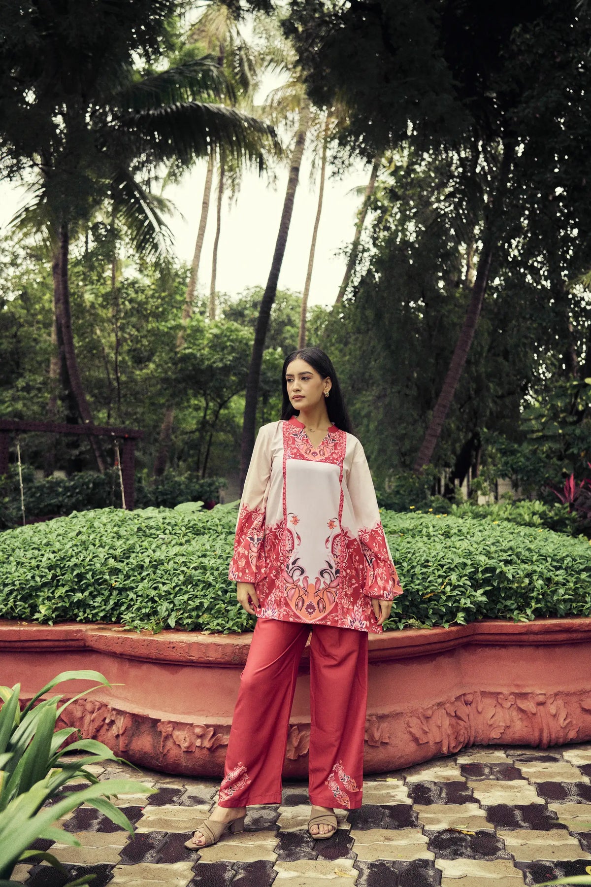 Model in a crimson paisley co-ord set